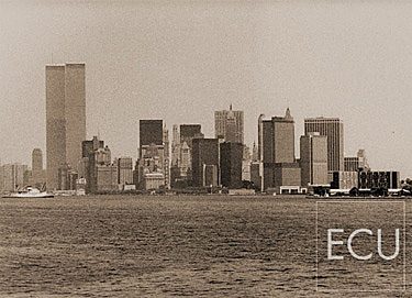 Black and white photo of Lower Manhattan skyline shot in the 1970s from the Staten Island ferry featuring the original World Trade Center
