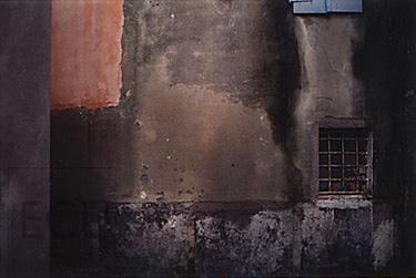 Color photograph of an abstract Venetian wall with a small vented window