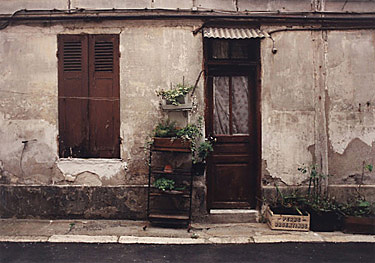 Color photograph of a traditional Parisian fa&ccedil;ade on rue du Chateau d'Eau the right bank in the 10th arrondisement, Paris, France