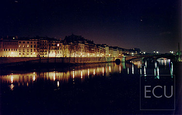 Color photograph of the Seine taken from the Parisian bridge Pont de l'Archev&ecirc;ch&eacute; looking to Ile St. Louis in winter at night in Paris, France